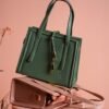 Stylish arrangement of designer handbags with chic modern appearance, ideal for fashion concepts.